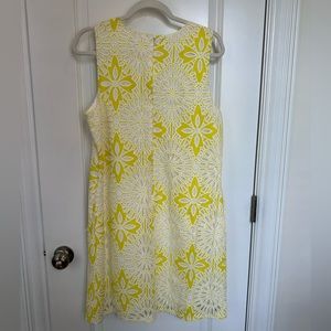 Yellow and white lacy floral shift dress.